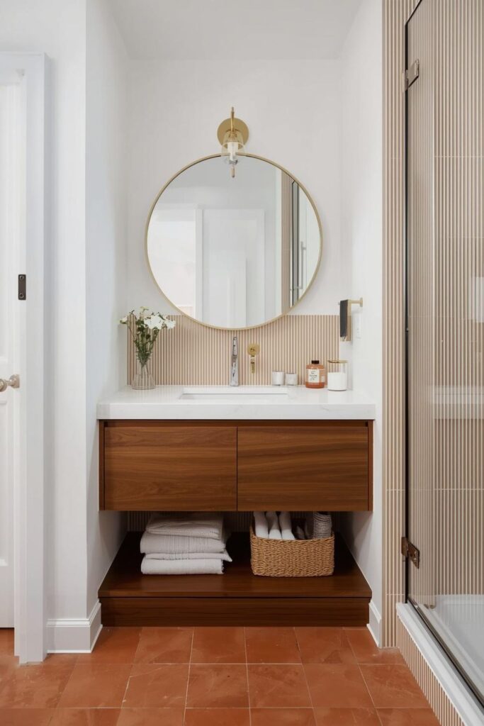 Earthy Terracotta Tile Accent With Curved Mirror Warmth