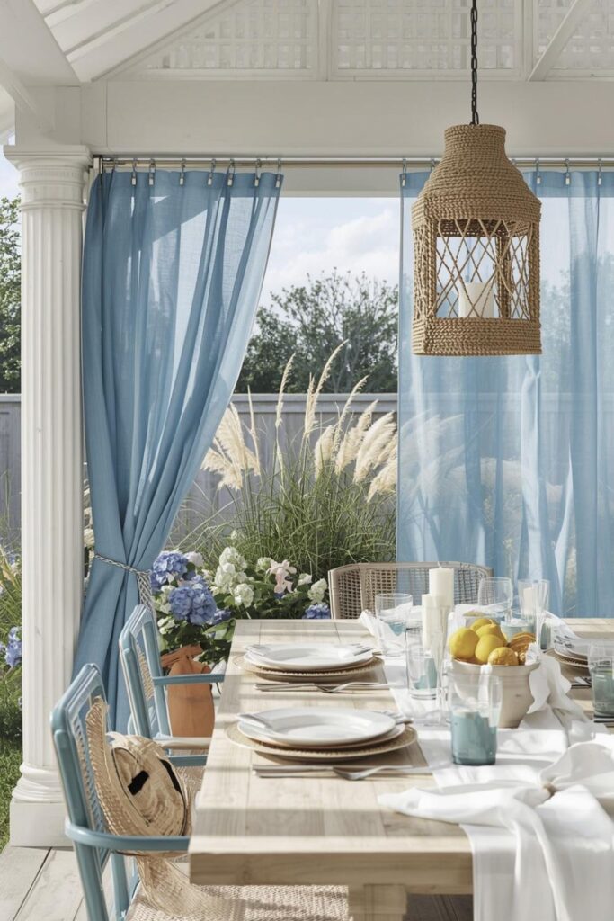 Coastal-Inspired Pavilion with Blue Drapes, White Lattice, and Breezy Table Decor