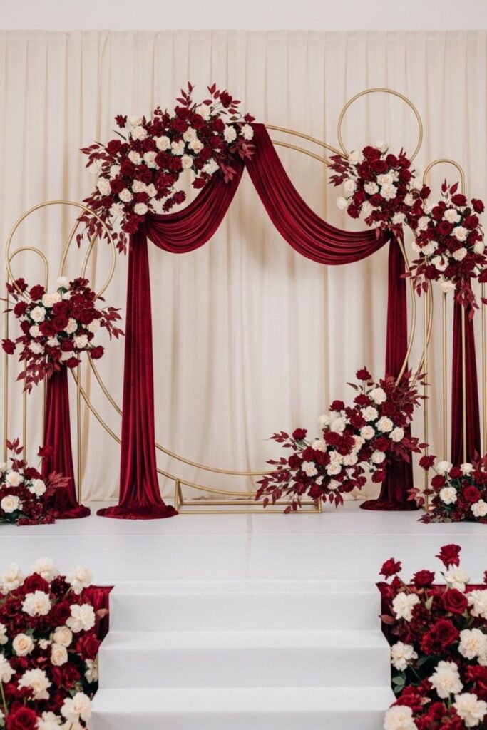 Gold Hoop Wedding Backdrop with Maroon and Cream Floral Clusters