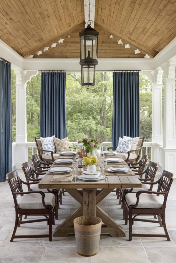 Rustic Wood Outdoor Dining Table in White Pavilion with Blue Drapes